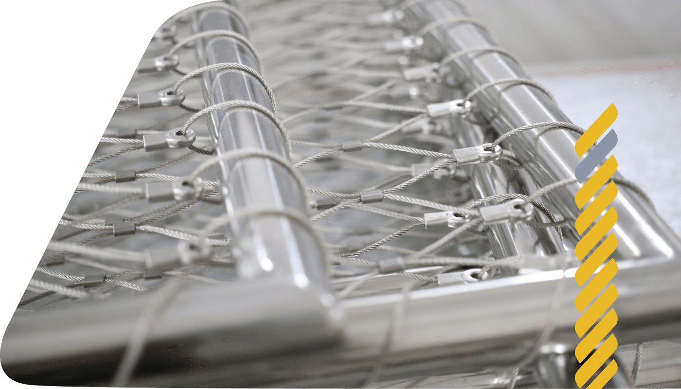 2 framed wire rope ferrule mesh panels are placed together.