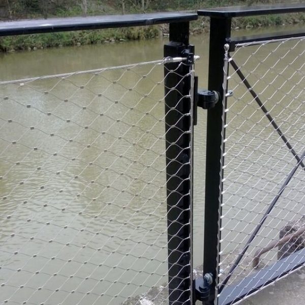 Frameless rope mesh system is installed on the riverside fence.