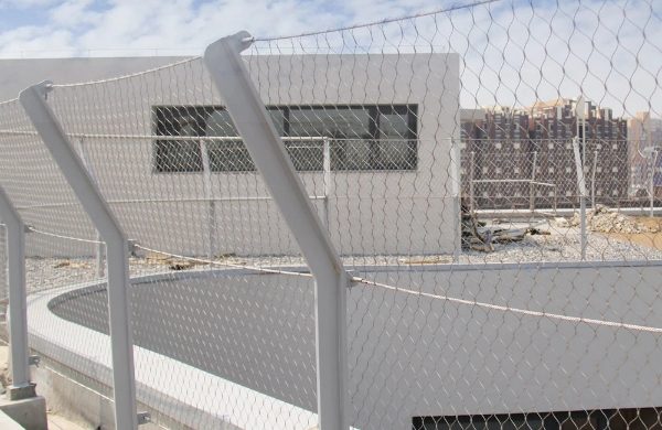 The road balustrade infill is made of stainless steel hand woven mesh.