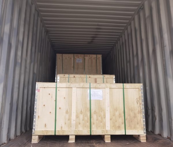 Wooden cases are placed in the truck compartment.