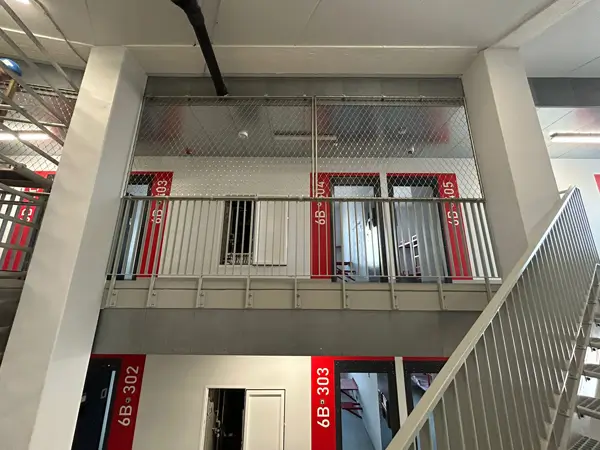 Vertical safety net installed on the exterior wall of a residential building