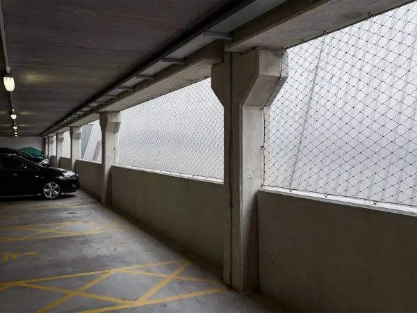 Vertical safety net installed on the exterior wall of parking lots