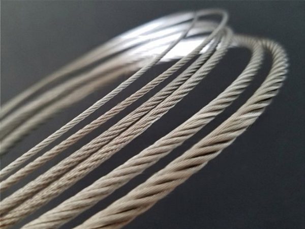 Several different diameters of wire ropes on black background